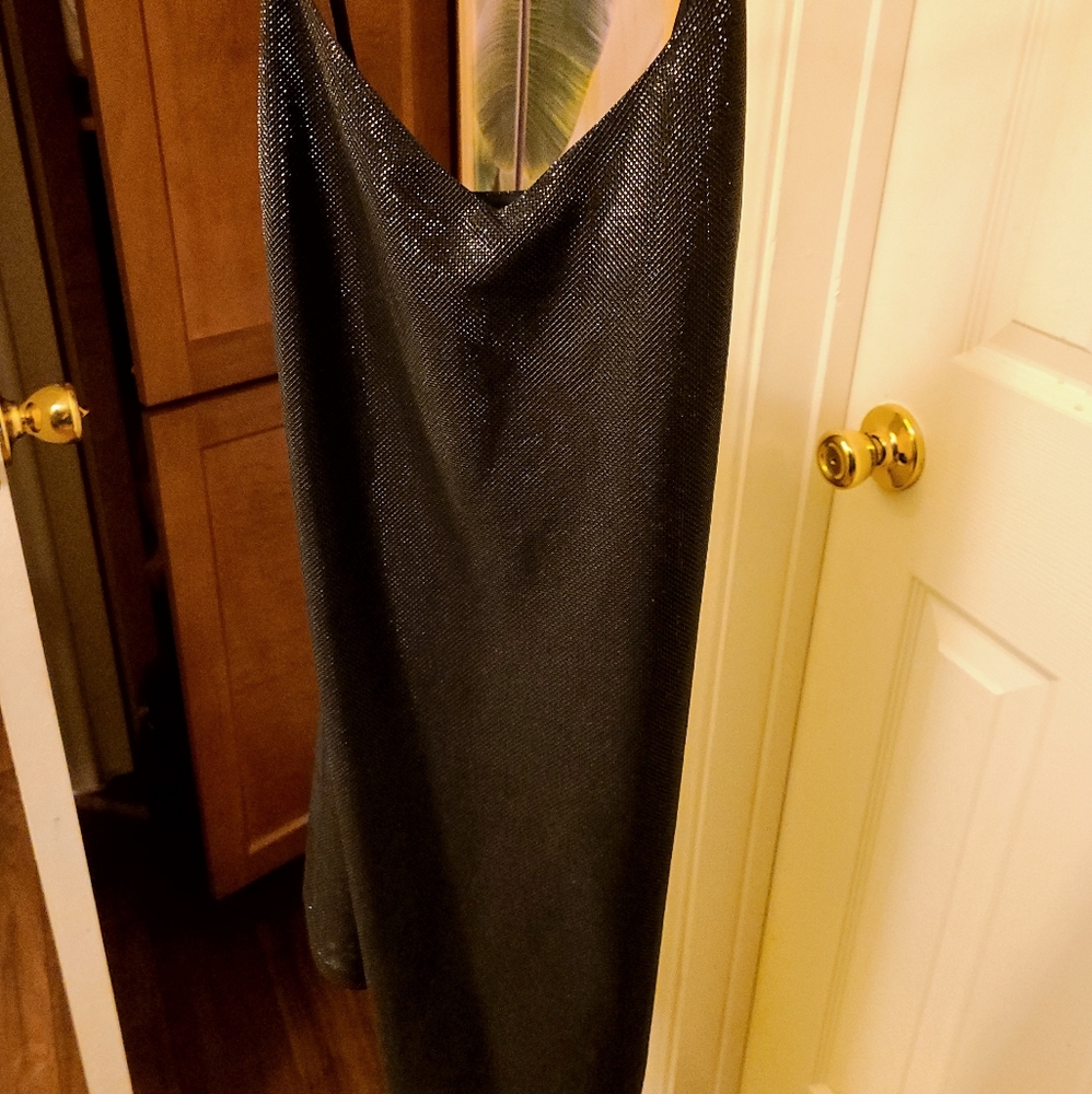 Glimmering little black dress with a strap…